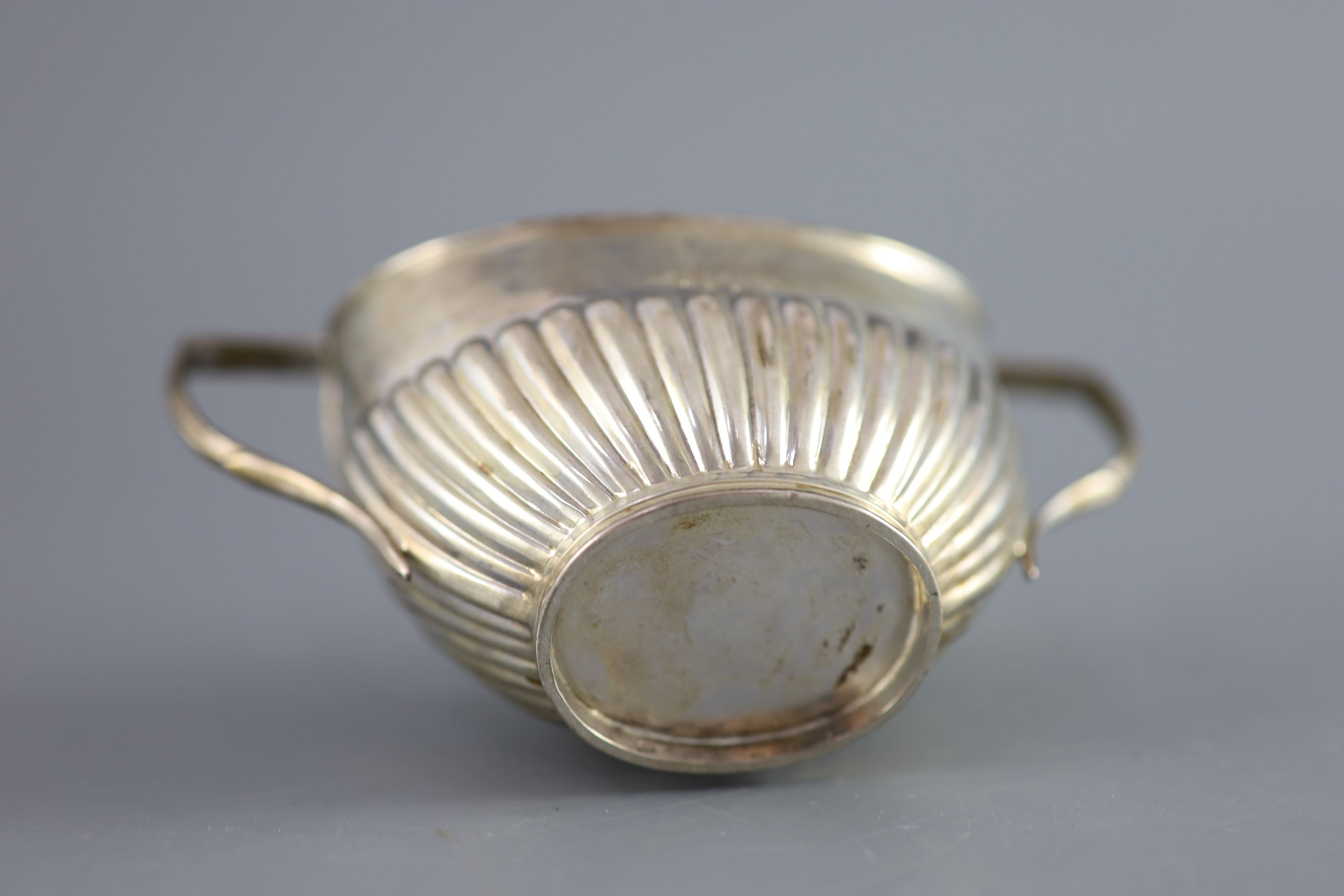 A Victorian demi fluted silver two handled oval sugar bowl, width 15.2cm, 107 grams.